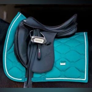 A bundle of dressage saddle pads